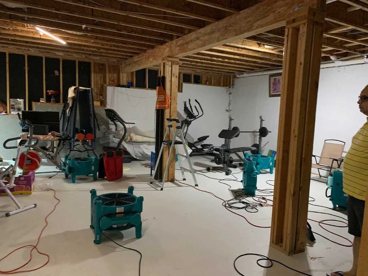 Basement drying equipment setup for Contents Cleaning & Restoration in Pella